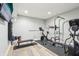 Home gym equipped with workout machines and exercise equipment, promoting a healthy lifestyle at 4429 Serengeti Cir, Carmel, IN 46074