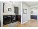Functional laundry room with modern washer and dryer, cabinetry and ceramic tile flooring at 4429 Serengeti Cir, Carmel, IN 46074