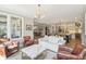 Bright, spacious living room showcasing hardwood floors and an open view into the kitchen at 4429 Serengeti Cir, Carmel, IN 46074