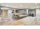 Spacious living room with a large sectional sofa, modern flooring, and ample space for relaxation at 4429 Serengeti Cir, Carmel, IN 46074