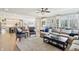 Spacious living room with an open floor plan, hardwood floors, and large windows at 4429 Serengeti Cir, Carmel, IN 46074