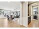 Open living room with built-in bookshelves and elegant trim, leading to another living space at 4429 Serengeti Cir, Carmel, IN 46074