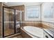 A well-appointed main bathroom is equipped with a large tub and walk-in shower at 4429 Serengeti Cir, Carmel, IN 46074