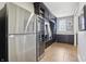 A well-equipped mudroom offers a wine cooler, storage lockers and bench with access to the home's interior at 4429 Serengeti Cir, Carmel, IN 46074