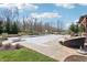 Spacious pool area with a covered pool, lounge chairs, and a pergola-covered seating area perfect for entertaining and relaxation at 4429 Serengeti Cir, Carmel, IN 46074