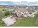 Expansive backyard featuring a covered pool, stone fireplace, and outdoor seating at 4429 Serengeti Cir, Carmel, IN 46074