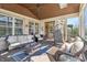 Relaxing sunroom with wicker furniture, ceiling fan, and ample natural light perfect for enjoying the outdoors from home at 4429 Serengeti Cir, Carmel, IN 46074