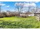 Spacious backyard with a grassy lawn and partial fencing at 4744 Whirlaway Dr, Indianapolis, IN 46237