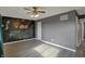 Spacious bedroom with neutral walls, floral accent wall, and ceiling fan light fixture at 4744 Whirlaway Dr, Indianapolis, IN 46237
