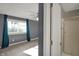 Bedroom with a view of the ensuite bathroom with a standing shower and grey walls at 4744 Whirlaway Dr, Indianapolis, IN 46237