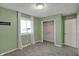 Bedroom featuring soft green walls, a window with natural light, and a closet at 4744 Whirlaway Dr, Indianapolis, IN 46237