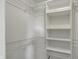 Walk-in closet with white wire shelving system at 4744 Whirlaway Dr, Indianapolis, IN 46237