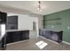 Kitchen with an island, granite counters, dark cabinetry, vinyl floors, and open access to the living room at 4744 Whirlaway Dr, Indianapolis, IN 46237