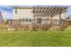 Spacious backyard features a wood deck with a pergola and a well-maintained lawn at 4747 Summit Lake Pl, Indianapolis, IN 46239