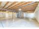 Unfinished basement with concrete flooring, exposed ceiling and a water heater at 4747 Summit Lake Pl, Indianapolis, IN 46239