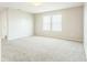 Bright bedroom features carpet, neutral walls, and natural light at 4747 Summit Lake Pl, Indianapolis, IN 46239
