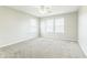 Bright bedroom features neutral walls, carpet, a ceiling fan and plenty of natural light from the windows at 4747 Summit Lake Pl, Indianapolis, IN 46239