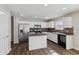 Modern kitchen features stainless steel appliances and a center island at 4747 Summit Lake Pl, Indianapolis, IN 46239