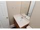 Bathroom vanity features a white sink, mirror, and neutral-toned walls at 5446 Lippan Way, Indianapolis, IN 46221
