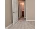 Neutral bedroom with carpet and view into the bathroom at 5446 Lippan Way, Indianapolis, IN 46221