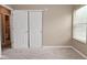 Comfortable bedroom with neutral walls, carpeting, closet and a window at 5446 Lippan Way, Indianapolis, IN 46221