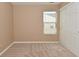 A bedroom with neutral walls and carpeted floors, window with blinds and closet with sliding doors at 5446 Lippan Way, Indianapolis, IN 46221