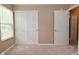 Bedroom with a carpeted floor, natural light from the window and closet with sliding doors at 5446 Lippan Way, Indianapolis, IN 46221