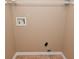 Unfinished storage closet with connections for a washing machine and dryer at 5446 Lippan Way, Indianapolis, IN 46221