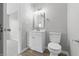 Bright bathroom featuring a modern vanity with a white countertop and a toilet at 6059 S Bay Dr, Indianapolis, IN 46250