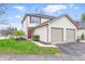 Charming townhome with attached two-car garage and well-manicured front yard at 6059 S Bay Dr, Indianapolis, IN 46250