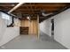 Unfinished basement showcasing exposed ceiling and painted concrete walls providing a blank canvas for customization at 6158 Ralston Ave, Indianapolis, IN 46220