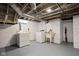 Unfinished basement with laundry area and a utility sink at 6158 Ralston Ave, Indianapolis, IN 46220
