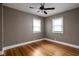 Empty bedroom featuring a ceiling fan and two windows at 6158 Ralston Ave, Indianapolis, IN 46220