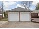 Detached two-car garage with white doors and a well-maintained exterior at 6158 Ralston Ave, Indianapolis, IN 46220