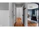 Hallway featuring hardwood floors and doorways leading to other rooms at 6158 Ralston Ave, Indianapolis, IN 46220