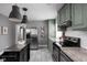 Kitchen area featuring stainless steel appliances, painted cabinets, and an island at 6158 Ralston Ave, Indianapolis, IN 46220