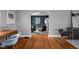 A stylish living room with hardwood floors and four chairs surrounding a glass coffee table at 6158 Ralston Ave, Indianapolis, IN 46220