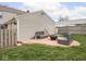 Green backyard with a patio, outdoor seating, and fenced in yard at 645 N Ritter Ave, Indianapolis, IN 46219