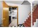 Basement entryway and stairs featuring a checkered tile floor at 645 N Ritter Ave, Indianapolis, IN 46219