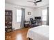 Comfortable bedroom with desk, bookcase, ceiling fan and natural light at 645 N Ritter Ave, Indianapolis, IN 46219