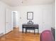 Cozy bedroom with hardwood floors, neutral walls, and a piano at 645 N Ritter Ave, Indianapolis, IN 46219