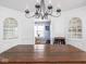 Dining room showcases a rustic wooden table, and cabinets with glasses at 645 N Ritter Ave, Indianapolis, IN 46219