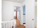 Bright hallway with hardwood floors and views of other rooms at 645 N Ritter Ave, Indianapolis, IN 46219
