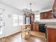 Charming kitchen with stainless steel refrigerator, a movable island, and plenty of natural light at 645 N Ritter Ave, Indianapolis, IN 46219