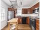 Spacious kitchen features stainless steel appliances, wooden cabinets, and a wooden island at 645 N Ritter Ave, Indianapolis, IN 46219