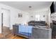 Bright living room with hardwood floors, fireplace, and comfortable gray sofas at 645 N Ritter Ave, Indianapolis, IN 46219