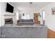 Spacious living room with hardwood floors, fireplace, and comfortable gray sofas at 645 N Ritter Ave, Indianapolis, IN 46219