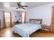 Spacious main bedroom with hardwood floors, modern furnishings, and lots of natural light at 645 N Ritter Ave, Indianapolis, IN 46219