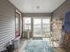 Charming sunroom with a tiled floor, neutral walls, and plenty of natural light at 645 N Ritter Ave, Indianapolis, IN 46219