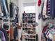 Walk-in closet providing ample storage with organized shelving and hanging space for clothes and shoes at 645 N Ritter Ave, Indianapolis, IN 46219